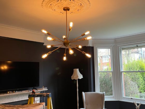 Professional electrician installing a circuit breaker