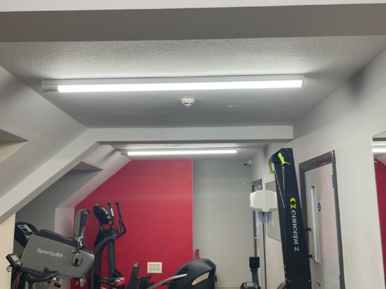 Professional electrician fixing electrical equipment