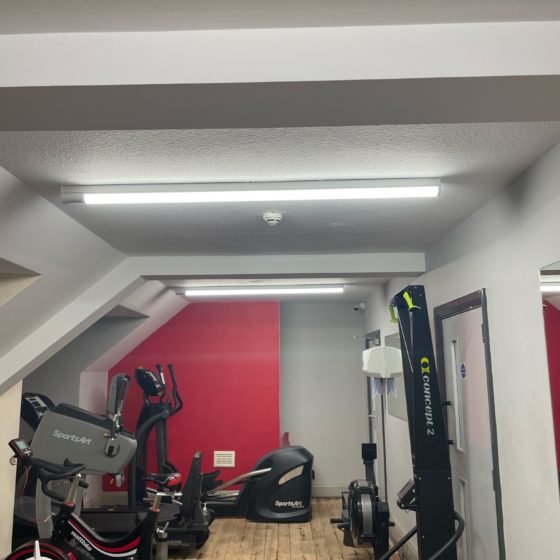 Professional electrician fixing electrical equipment