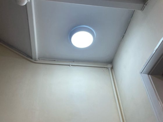 Electrician repairing wiring on a residential site