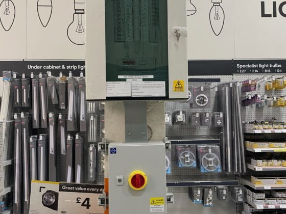 Professional electrician repairing electrical box