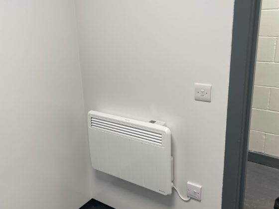 Professional electrician repairing electrical system