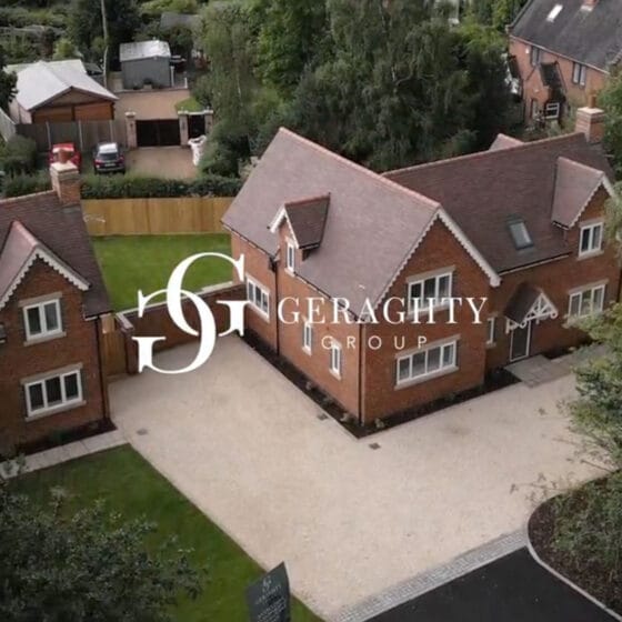 Aerial view of large house and garden.