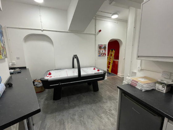 full shop refurbishment air hockey table in staff room