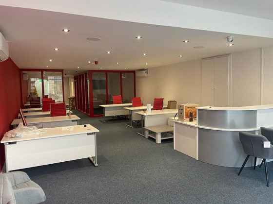 full shop refurbishment red chairs white desks