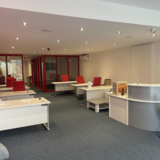 full shop refurbishment red chairs white desks
