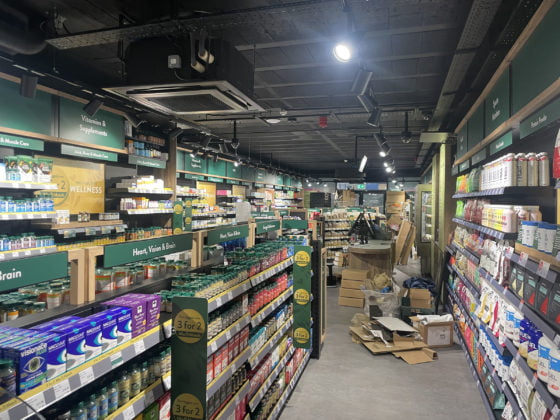 Health food shop interior with supplements and products.