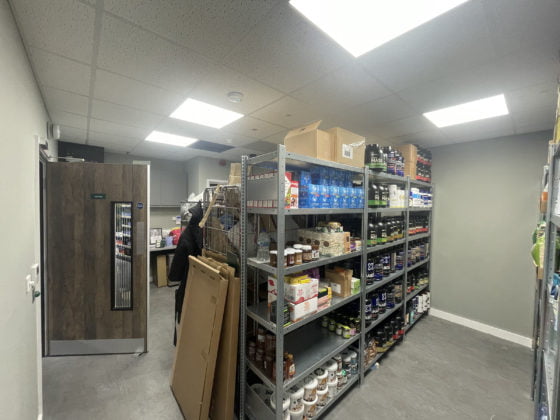 Interior of a well-stocked storage room with shelves.