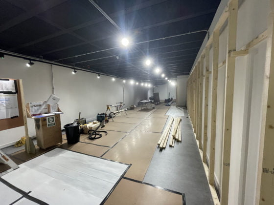 Indoor construction site with materials and tools.